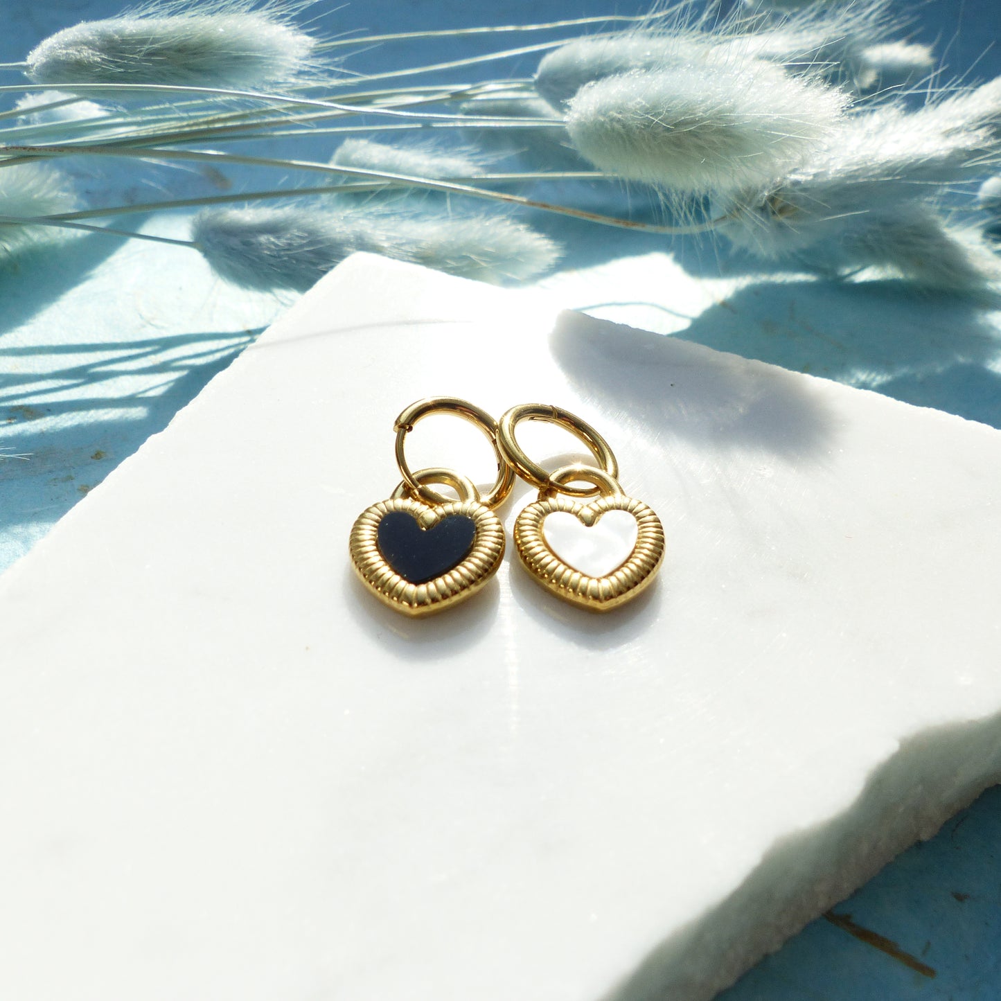 Herzförmige Ohrringe in Gold und Silber mit Wechselseite aus Edelstahl