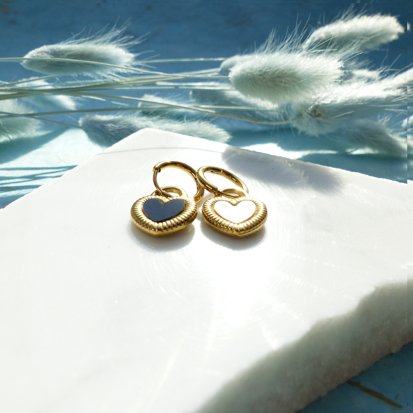 Herzförmige Ohrringe in Gold und Silber mit Wechselseite aus Edelstahl