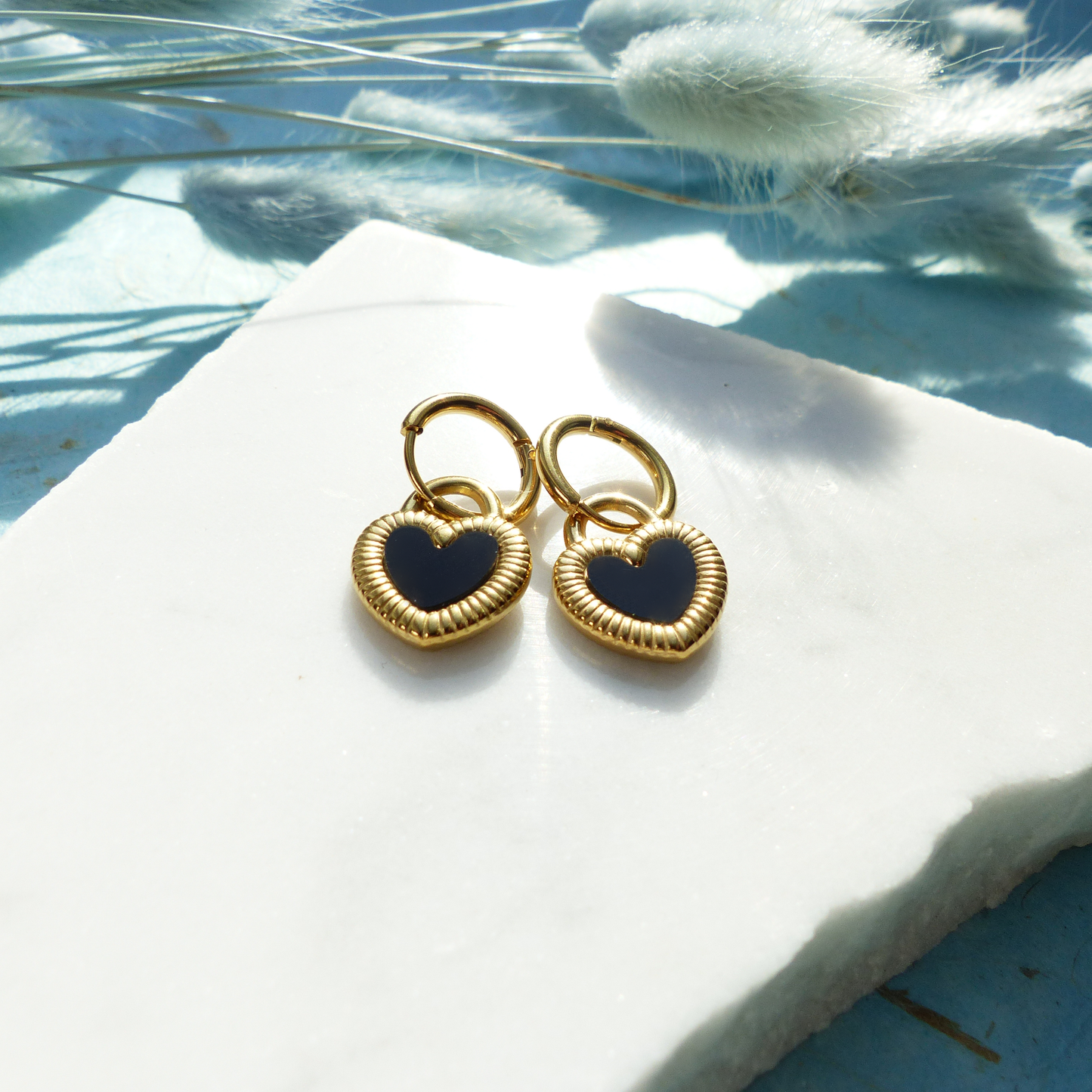 Herzförmige Ohrringe in Gold und Silber mit Wechselseite aus Edelstahl