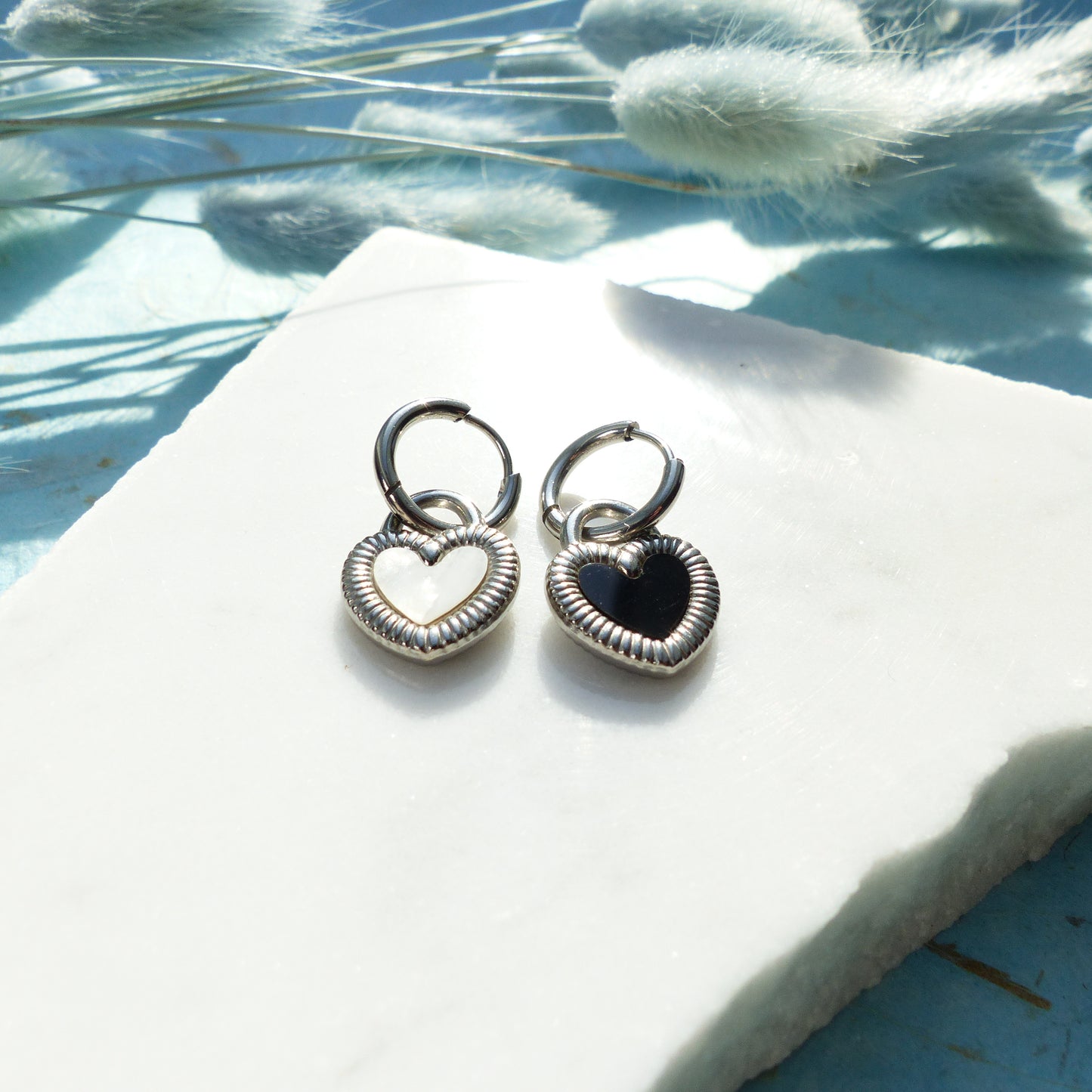 Herzförmige Ohrringe in Gold und Silber mit Wechselseite aus Edelstahl