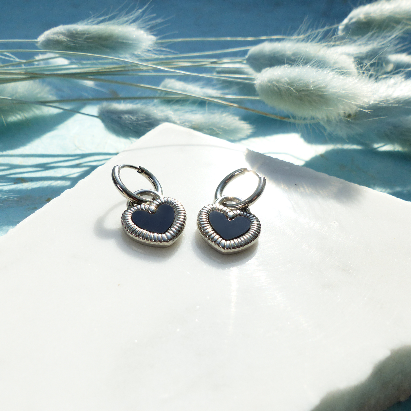 Herzförmige Ohrringe in Gold und Silber mit Wechselseite aus Edelstahl